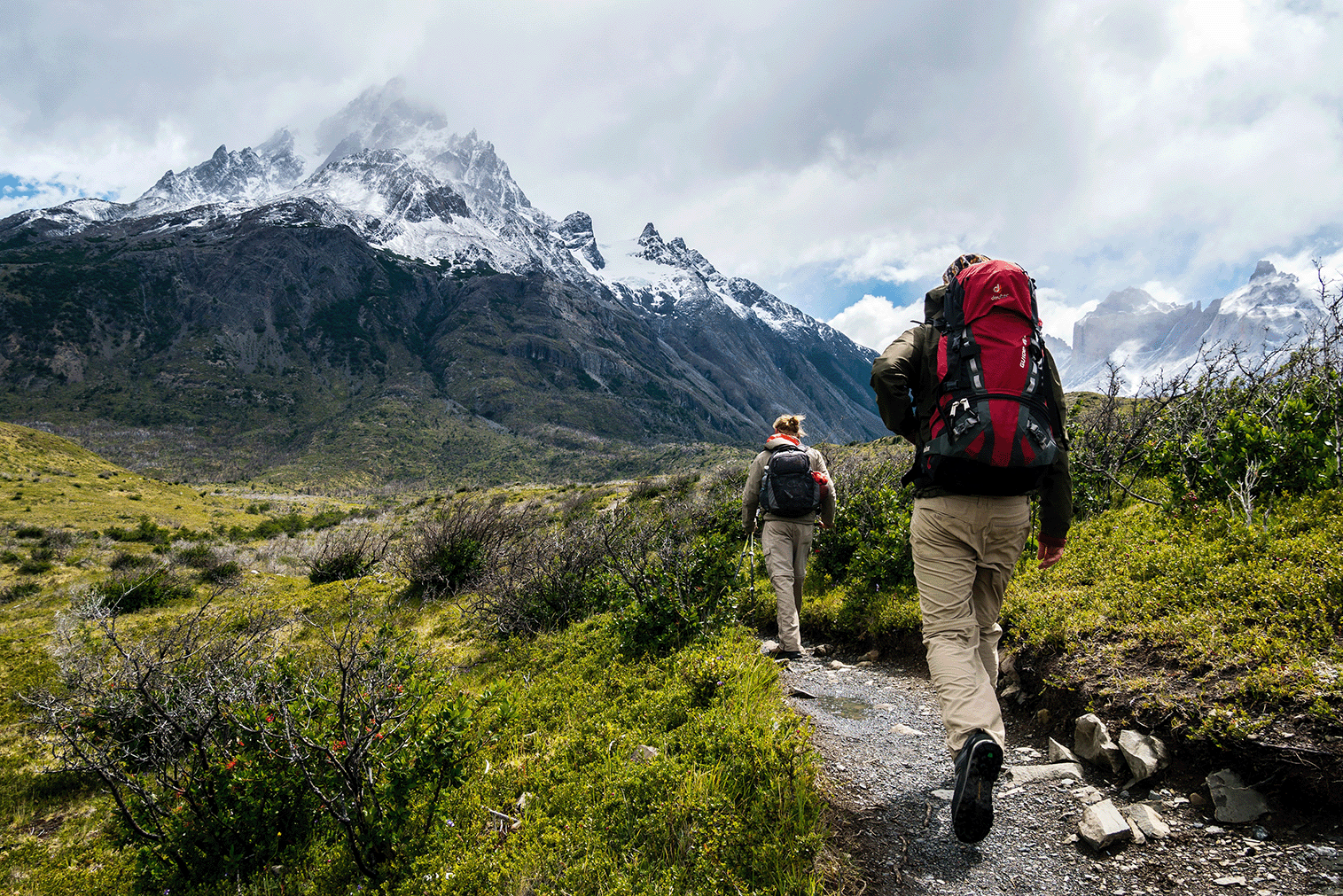 Two people hiking to a mountain