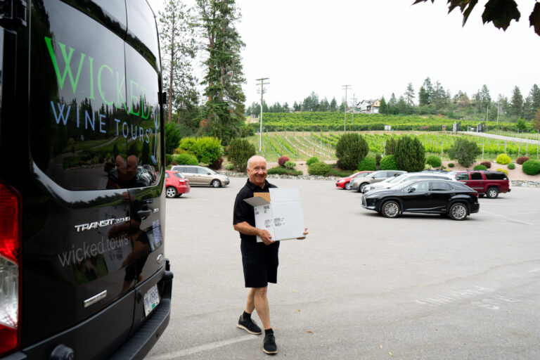 A Wicked Wine Tours employee and van