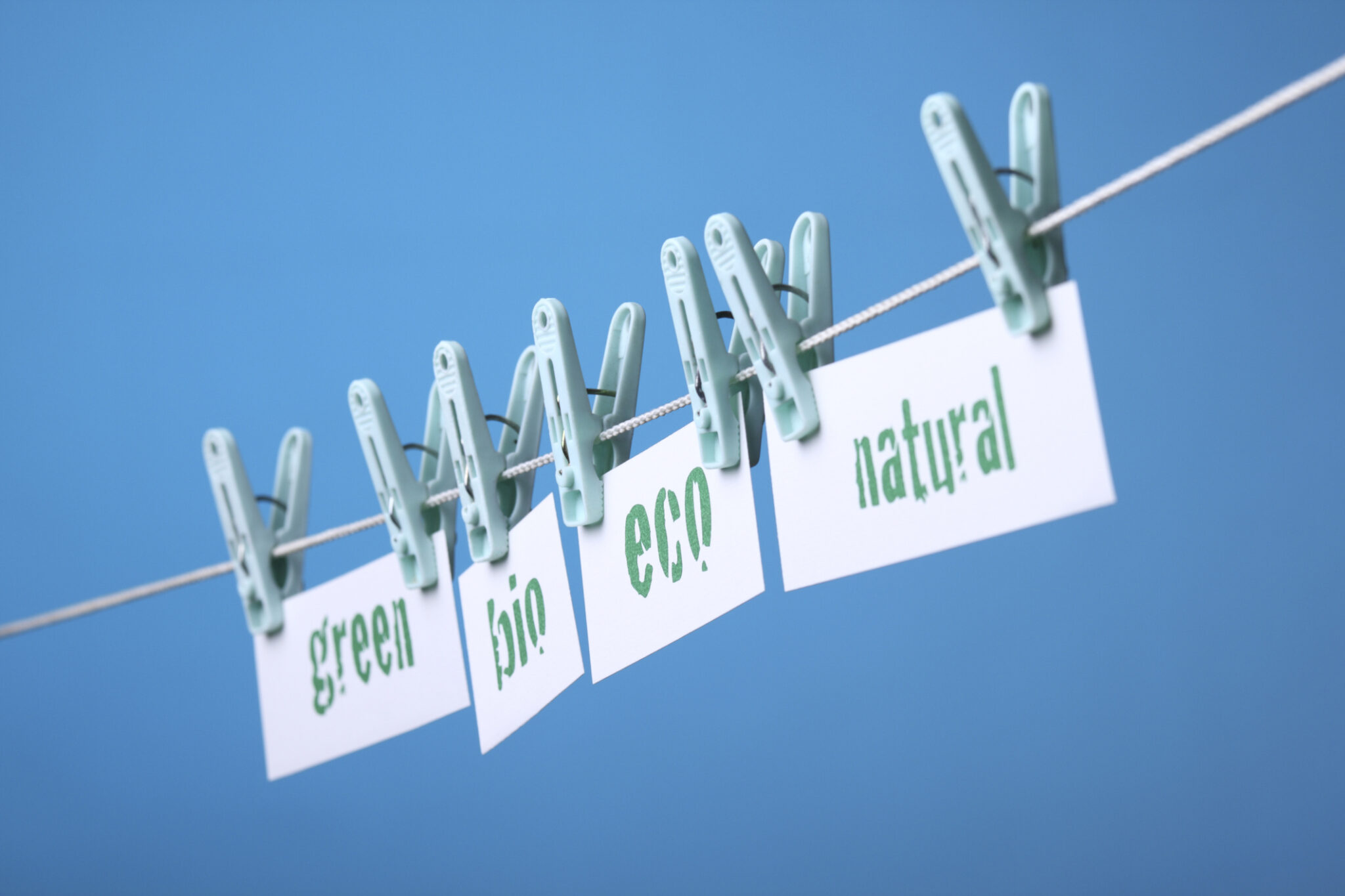 Pieces of paper on a clothesline "green" "bio" "eco" "natural"